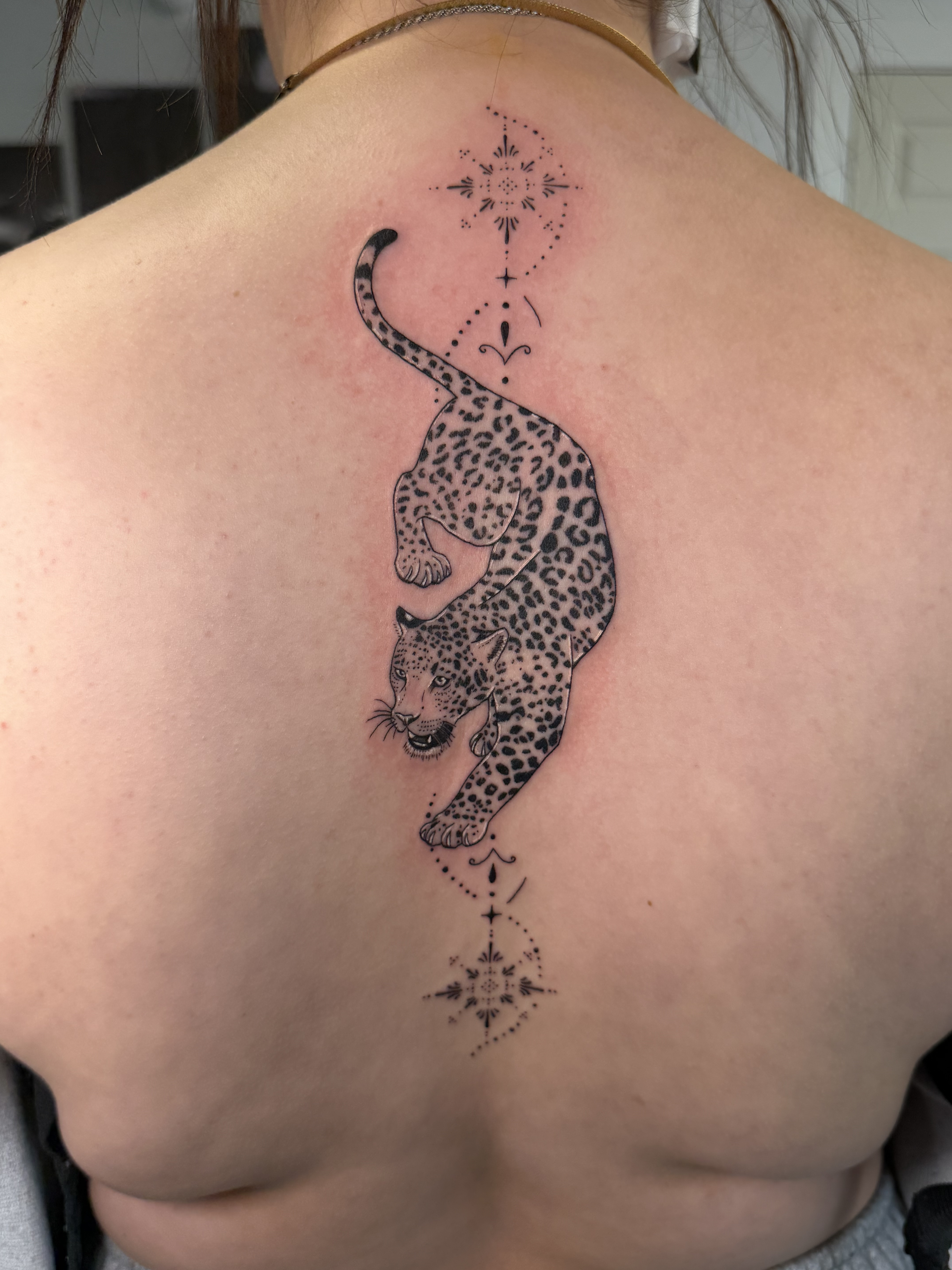 Fine-line leopard back piece